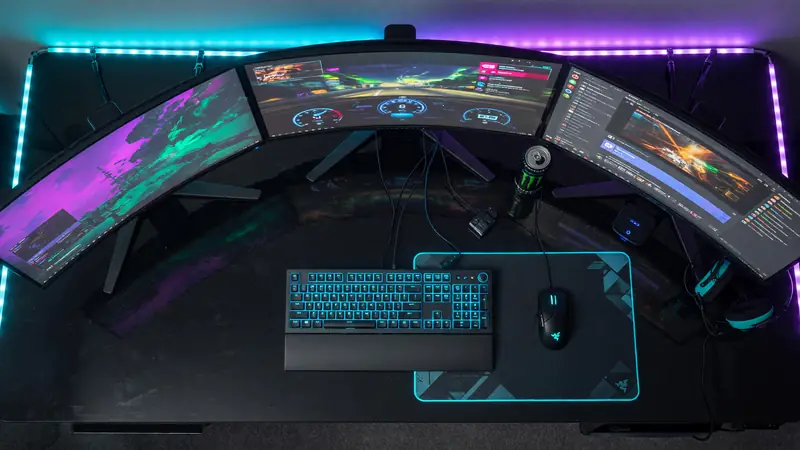 Editorial photograph of an empty competitive gaming arena with cool blue floor strip lights